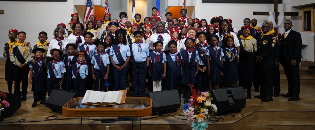 Adventurers and Pathfinders gathered for a group photo in the church sanctuary